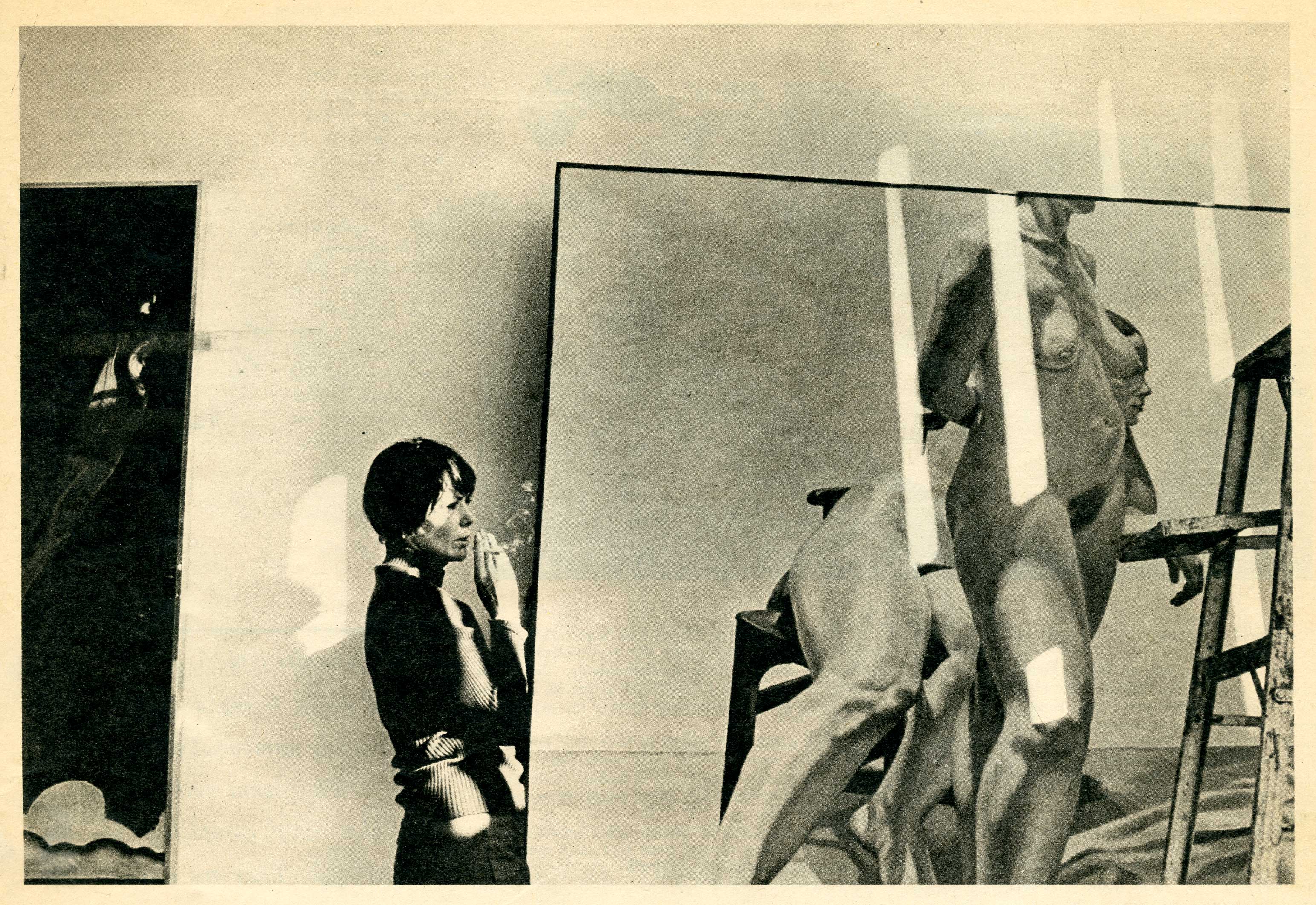 smoking woman next to large painting of nude